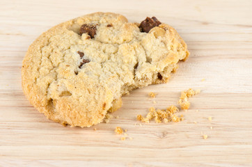 Chocolate chip cookies on wooden table.