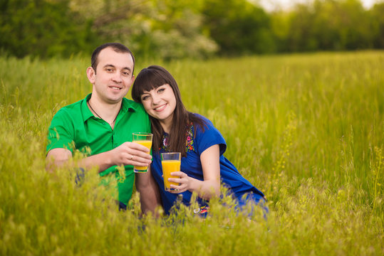 Pregnant Couple drinking juice