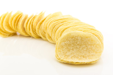 row of potato chips on white background