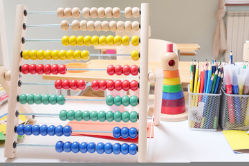 Wooden abacus with many colorful beads