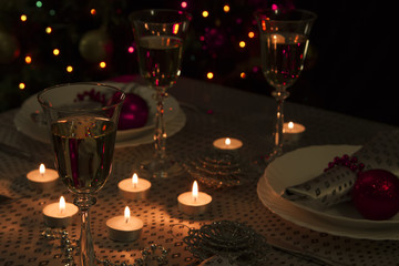 Christmas dinner table. Traditional Christmas decorations. Served table in a restaurant. Beautifully set table for Christmas Eve.