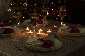 Christmas dinner table. Traditional Christmas decorations. Served table in a restaurant. Beautifully set table for Christmas Eve.
