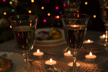 Christmas dinner table. Traditional Christmas decorations. Served table in a restaurant. Beautifully set table for Christmas Eve.