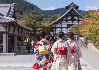 Japanese women in kimono is walking to Tenryu-ji temple, Kyoto, Arashiyama, Japan.