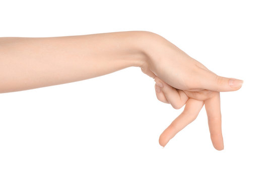 Beauty and Health theme: beautiful elegant female hand show gesture on an isolated white background in studio