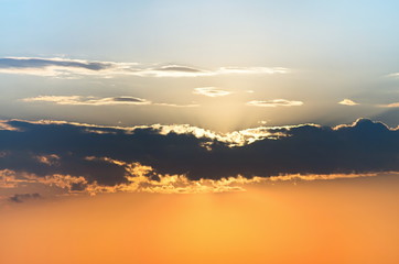 Sunrise behind clouds