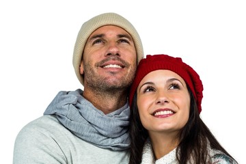 Smiling couple looking up