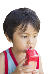 Cute Asian little boy holding milk