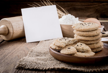 Rural vintage wooden kitchen table with old blank sheet of paper