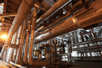 different size and shaped pipes and valves at a power plant