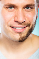 Fototapeta premium Happy man with half shaved face beard hair.