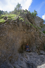Large cliff with young woman