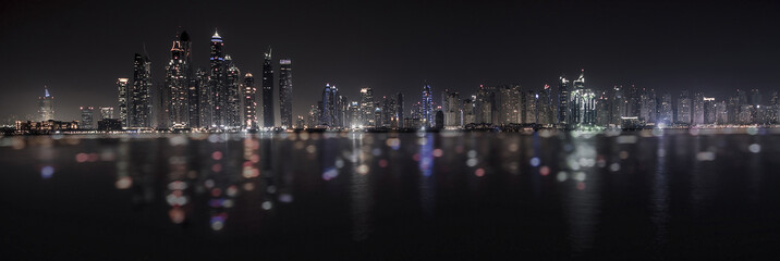 Obraz na płótnie Canvas Dubai Marina reflection viewed from Palm Jumeirah