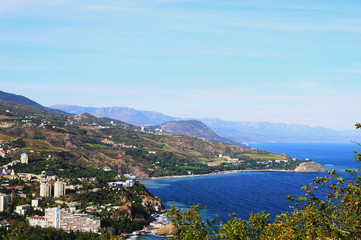 Fototapeta na wymiar Top view of township Partenit and Black sea coast from mountain Ayu-Dag, Crimea, Russia