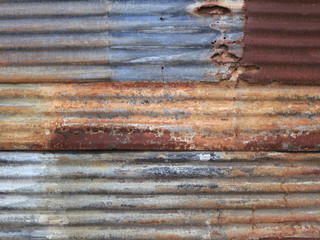 Wall of corrugated iron sheet in a poor district of Inhambane, Mozambique, Africa