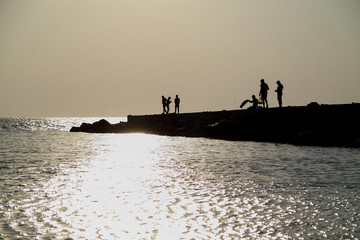 silhouette people on sunset