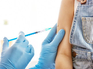 a vaccination to a child