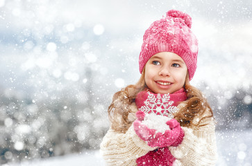 girl playing on a winter walk