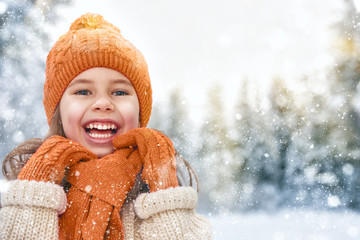 girl playing on a winter walk