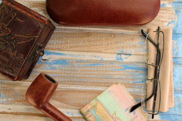 Smoking pipe, eyeglasses case, eyeglasses, money and box - copy space