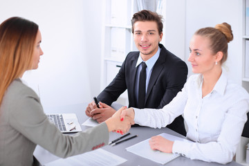 Business people shaking hands, finishing up a meeting