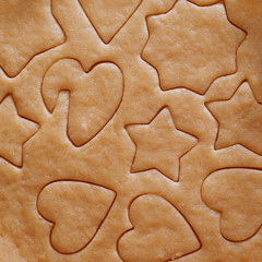 Dough rolled out and cookies cut out