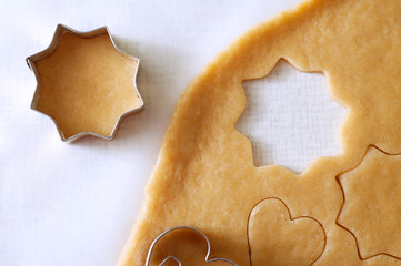 Dough rolled out and cookies cut out