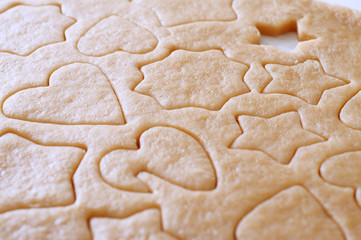 Dough rolled out and cookies cut out