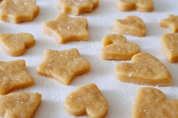 Dough rolled out and cookies cut out