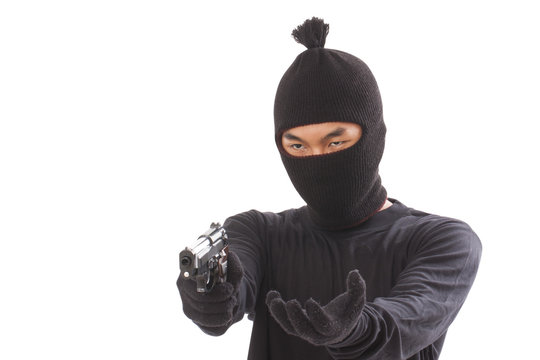 Burglar holding hand gun 