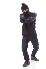 Burglar holding hand gun 