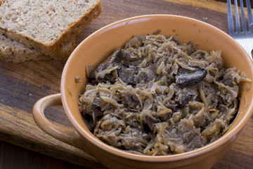 Fototapeta na wymiar Traditional polish sauerkraut with mushrooms