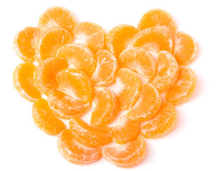 Heart-shaped group of mandarines on white background