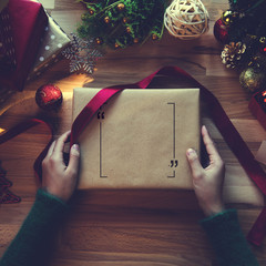 Overhead shot of Christmas presents and wrapping papers