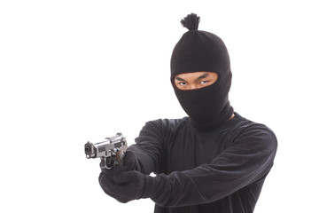 Burglar in a mask with a gun on a white background