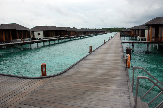 Timber pier and bungalow at Maldives