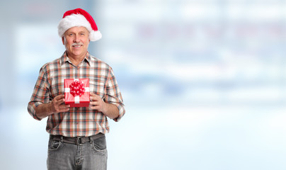 Obraz premium Happy Christmas man with xmas gift.