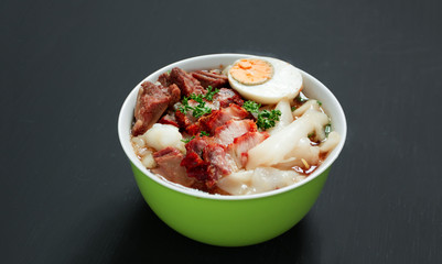 Crunchy Pork Soup on black background