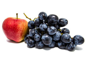 Red Apple and dark grapes isolated on a white background