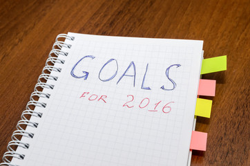 goals of year 2016 write on notebook on wooden background