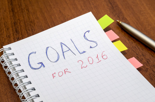 goals of year 2016 write on notebook on wooden background