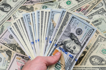 different dollar bills as background