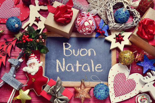 ornaments and text buon natale, merry christmas in italian - Powered by Adobe