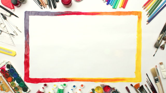 Artistic border painting with art tools and colors. Top view, stop motion animation.