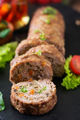 Minced meat loaf roll with mushrooms and carrots.