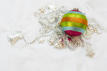 Rainbow Christmas ball with christmas chain on a white backgroun