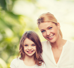 smiling mother and little girl