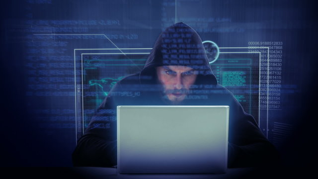 Composite video of hacker using laptop