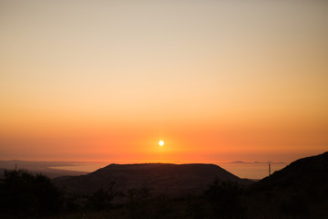 sunset silhouette with sea in background