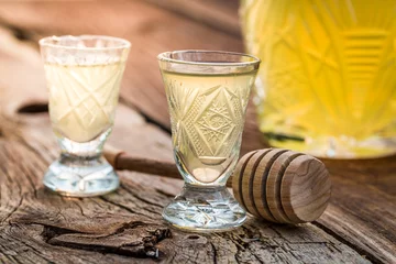 Foto auf Acrylglas Bar Tasty liqueur with alcohol and honey